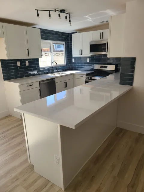 Kitchen upgrade with modern cabinet and backsplash finish work