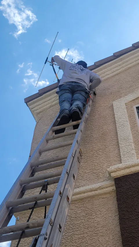 HOA violation repair project photo showing exterior stucco, paint or property correction work