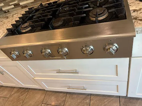 Kitchen appliance, cabinet and floor detail from a client remodeling project