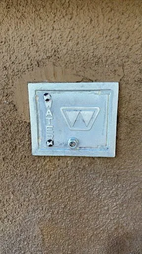 Commercial utility cover repair and exterior wall detail photo