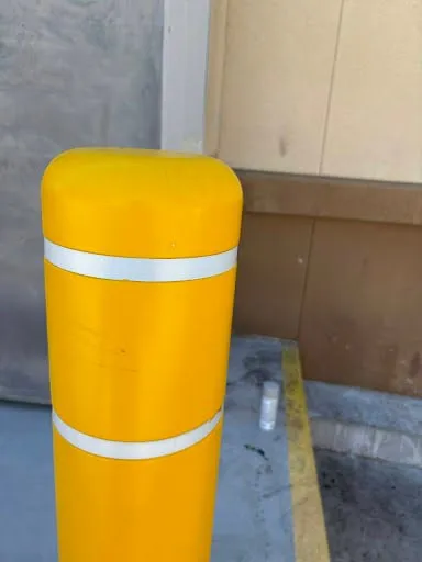 Commercial safety bollard repaint and exterior repair photo