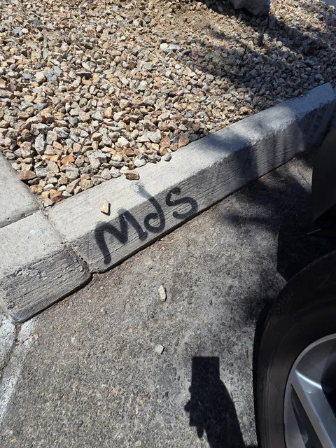 Commercial parking curb cleanup and exterior property maintenance photo