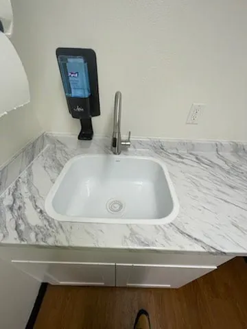 Commercial laundry room sink and counter repair detail photo