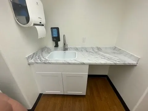 Commercial laundry room cabinet and sink repair photo