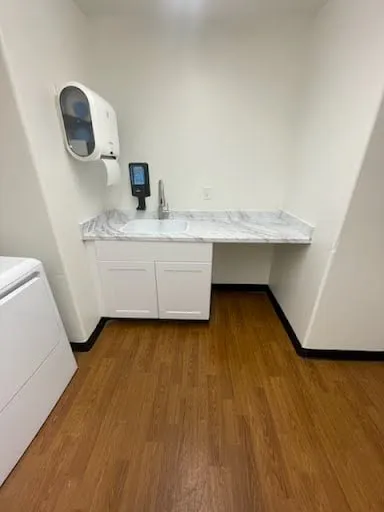 Commercial laundry room counter and fixture repair photo