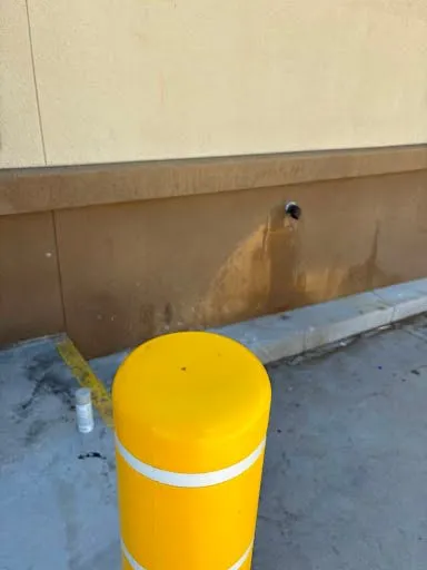 Commercial bollard and exterior wall repair photo