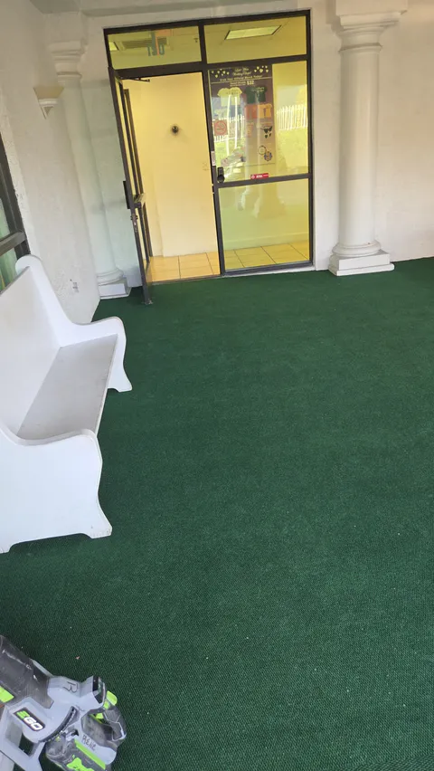 Commercial storefront entry turf and walkway repair photo