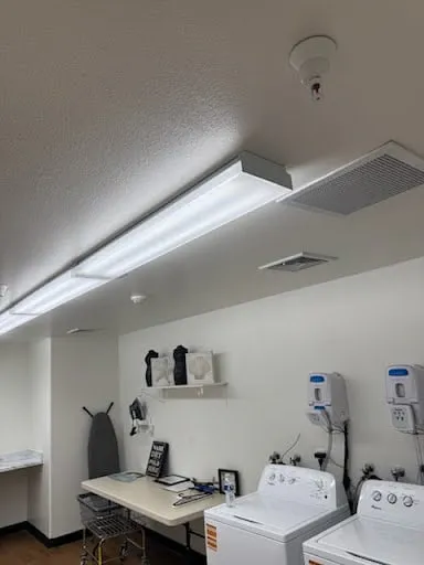 Commercial laundry room fixture, wall and appliance area repair photo