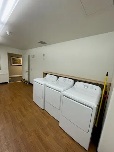 Commercial laundry room wall and washer area repair photo