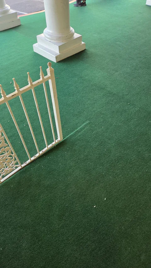 Commercial entry gate turf and storefront walkway repair photo