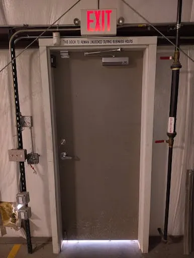 Commercial exit door hardware and closer repair photo